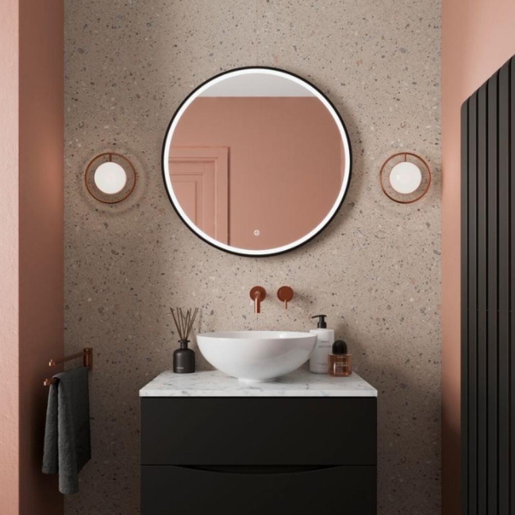 Lifestyle image of the Showerwall Laminate Cantera Stone 2440mm x 900mm Square Cut Hydrocore Wall Panel - SW90 on a small section of bathroom wall with basin & mirror setup